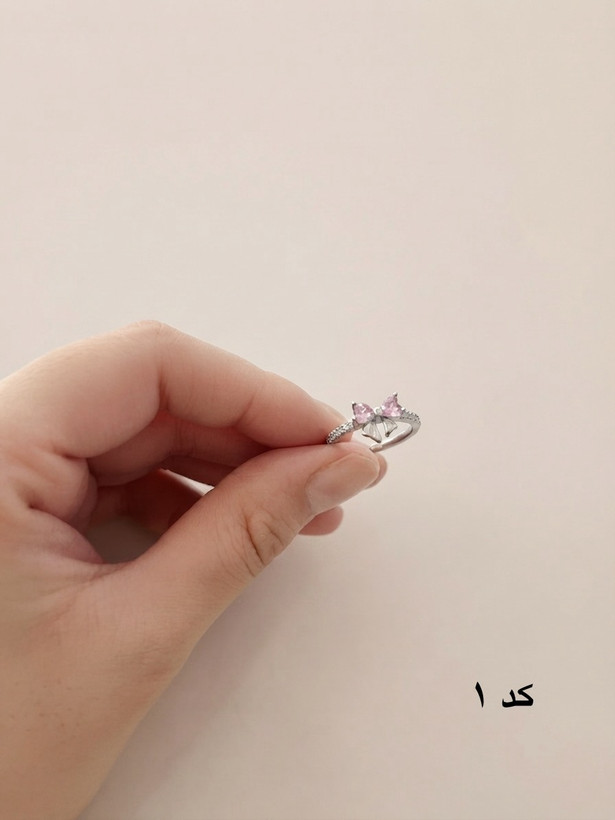 انگشتر زنانه مدل پاپیون کریستالی صورتی | فری سایز ضد حساسیت